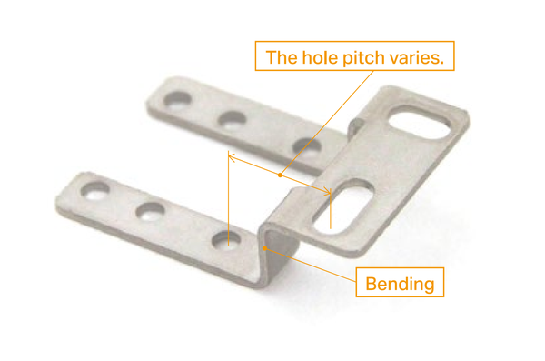 The hole pitch varies. Bending