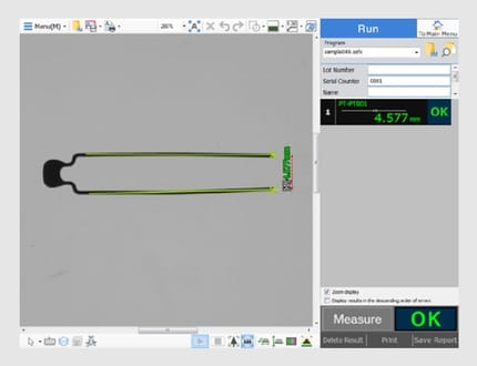 The measurement screen shows the two lead tips connected by a line, with the measured distance and an OK judgment.