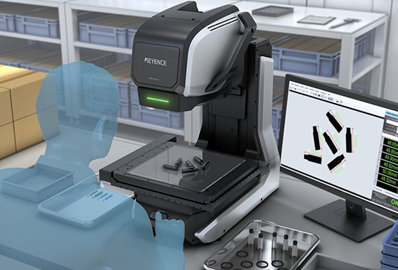At an incoming-goods desk stacked with parts bins, the screen measures several small supplied parts together.