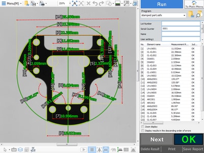 A measurement results screen showing automatically measured dimensions on a part, each with a pass/fail judgment.